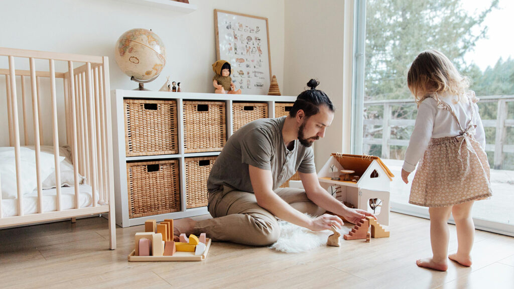 Father and daughter building a block house, enjoying mindful parenting playtime