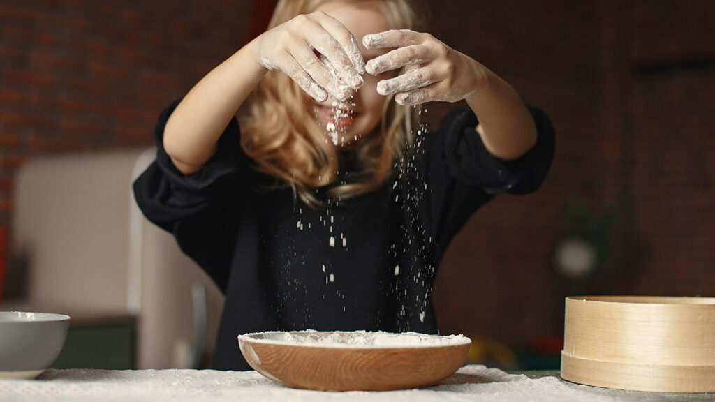 Girl sensory play with dough