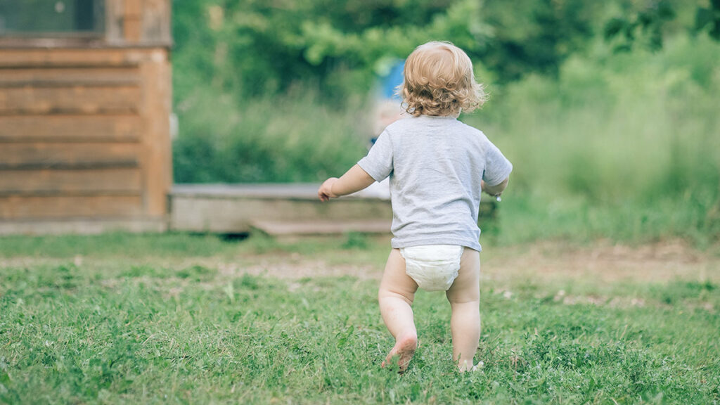 Mindfulness Exercises for Toddlers: baby walking on the grass